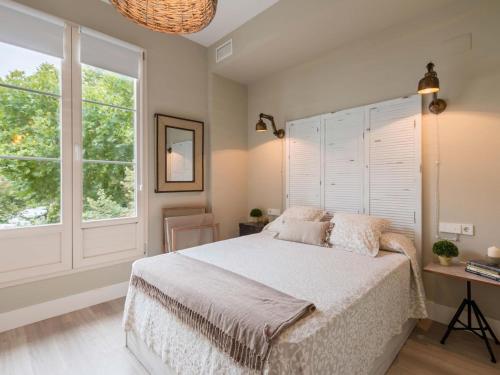 A bed or beds in a room at Trinidad Deluxe 1