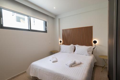 Cama o camas de una habitación en VUAR SUITES