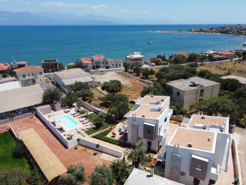 an aerial view of a resort and the ocean at VUAR SUITES in Petalidi