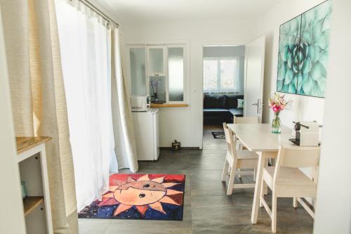 a living room with a table and a dining room at Natalies Hideaway in Thun