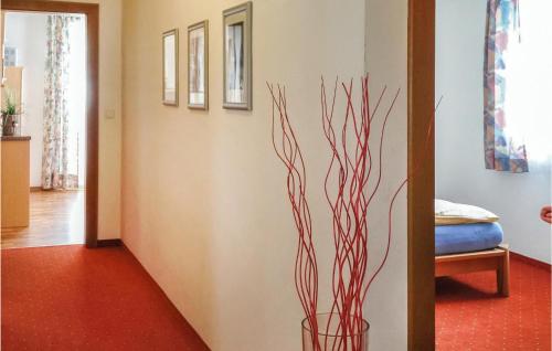 a vase with a plant in the corner of a room at Nice Apartment In Mhlbach With 3 Bedrooms in Mühlbach am Hochkönig