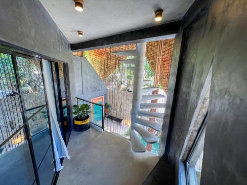 an overhead view of a staircase in a house at Happiness Kulambo Villa El Nido in El Nido