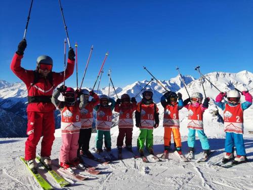 a group of people on skis in the snow at Apartment Haus Christina in Großkirchheim