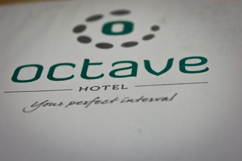 a close up of the logo of a hotel at Octave Hotel & Spa - Marathahalli in Bengaluru