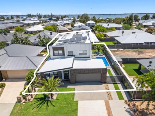an aerial view of a house in a suburb at The Palms Guest House Yarrawonga in Yarrawonga