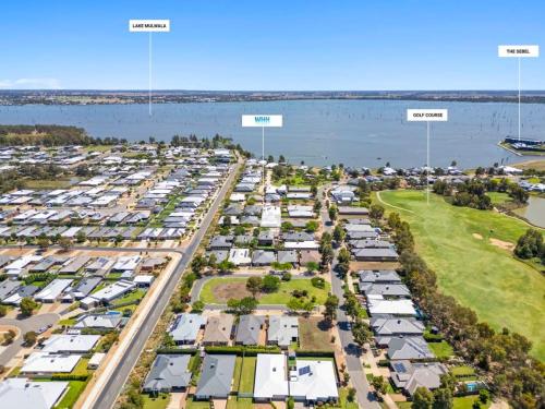 an aerial view of a parking lot with houses at The Palms Guest House Yarrawonga in Yarrawonga