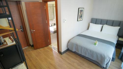 a bedroom with a bed and a door to a bathroom at Dosso Dossi Hotels Old City in Istanbul