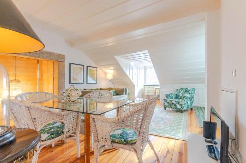 a dining room with a table and chairs at Portas da Sé Apartments in Lisbon