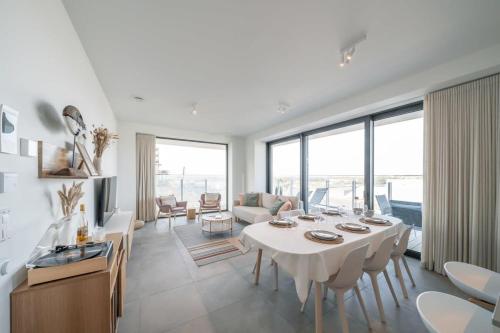 Et opholdsområde på Huswell - Modern new apartment with pool access and parking