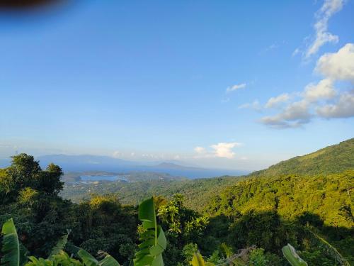 a view of a valley with mountains and forests at Puerto Galera Transient Guest Room in Puerto Galera