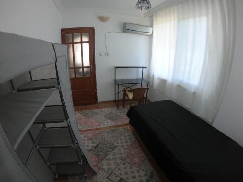 a bedroom with a bunk bed and a ladder at Gazipasa/Alanya Airport Apt 5minBEACH/5minAIRPORT in Gazipasa