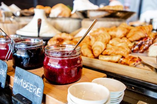 a counter with jars of jam and other pastries at Hyatt Regency Dusseldorf in Düsseldorf