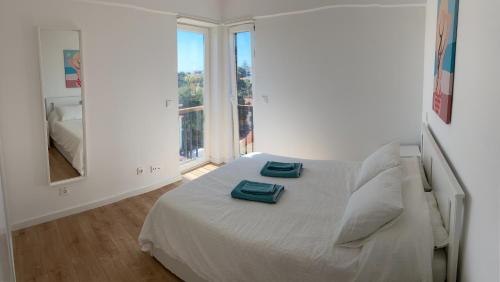 מיטה או מיטות בחדר ב-Casa do Sol