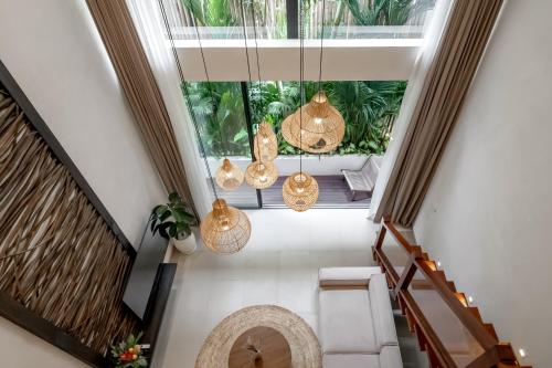 an image of a hallway with pendant lights at Sunny Cuddles in Canggu