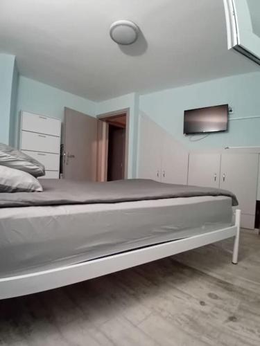a bedroom with a bed in a room at All_aRRound! in Nafpaktos