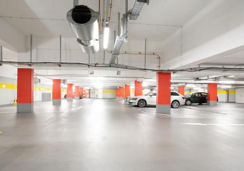 a parking garage with two cars parked in it at Residenz am Zwinger in Dresden
