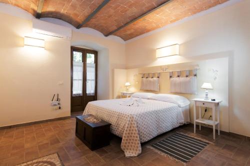 Postel nebo postele na pokoji v ubytování Agriturismo La Quiete