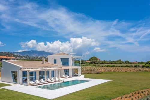 a villa with a swimming pool and a house at My Kefalonia Villa in Minia