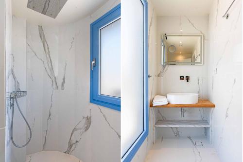a bathroom with a shower with a window and a sink at My Kefalonia Villa in Minia