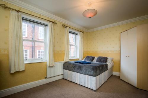 a bedroom with a bed and a window at Spacious, 3 Bed House for 6 in Central Chester in Chester