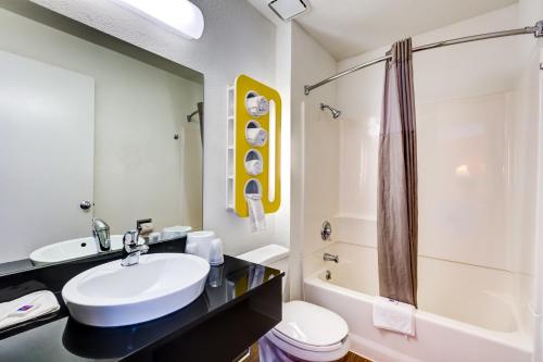 a bathroom with a sink and a toilet and a shower at Motel 6-Wheat Ridge, CO - West - Denver North in Wheat Ridge
