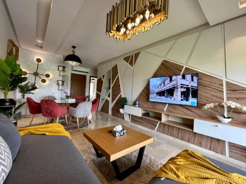 a living room with a couch and a table at Luxury apartments in Marrakesh