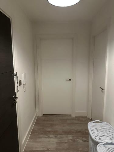 an empty hallway with a door and a window at Beautiful 1-Bed Apartment in Birmingham - Solihull in Birmingham
