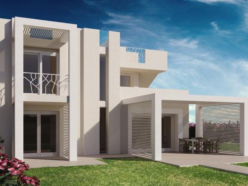 uma representação de uma casa branca com um quintal em Holiday home close to the beautiful beaches in world em Stintino