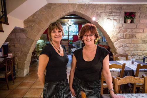 two women standing next to each other at Casa del Infanzón in Sos del Rey Católico