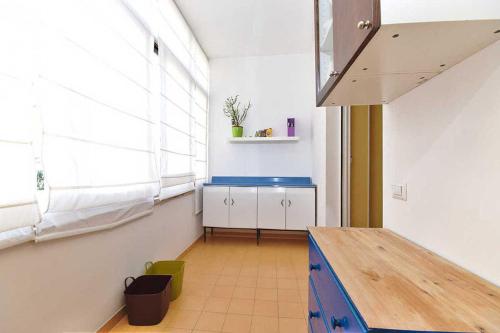 a kitchen with a table in a room with a window at Rome Sleep Home Bed & Breakfast in Rome