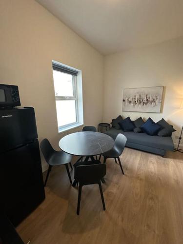 a living room with a table and a couch at Central Dublin Apartment in Dublin