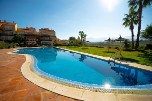 a large swimming pool in a resort at Sunstay House Sol Andalusi Alhaurin in Alhaurín de la Torre