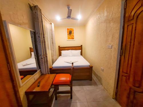 Postel nebo postele na pokoji v ubytování Best Point Hotel Zanzibar