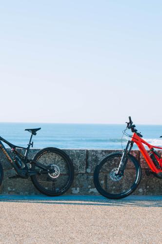 two bikes parked next to each other next to the ocean at Moledo Shoreline in Moledo