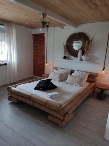a bedroom with a large bed with a head board at Finca Rayo del Sol in Alhaurín el Grande