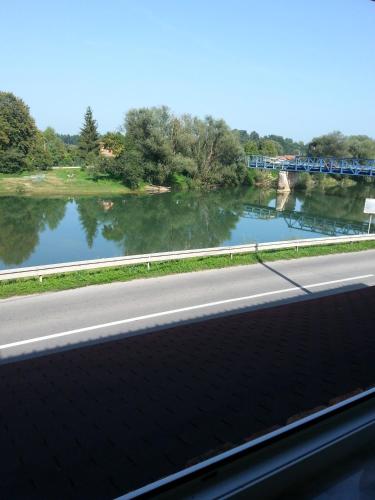a view of a river from a highway at Guesthouse Kod mosta in Karlovac