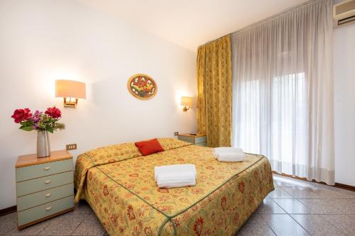 a hotel room with a bed and a window at Camelia Rooms Venice Guesthouse in Mestre