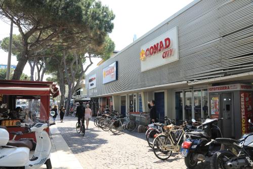 a group of bikes parked in front of a store at Zuara9Room Rimini in Rimini