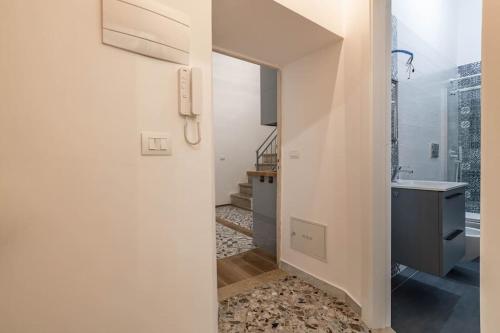a white bathroom with a sink and a mirror at U Paradise - Intero Apt - Vicino Bari in Valenzano
