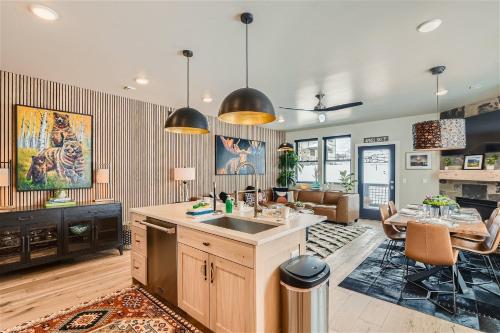 a kitchen with a sink and a table in a room at Helling Circle Secret 102 condo in Heber City