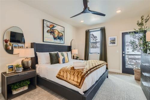 a bedroom with a bed and a ceiling fan at Helling Circle Secret 102 condo in Heber City
