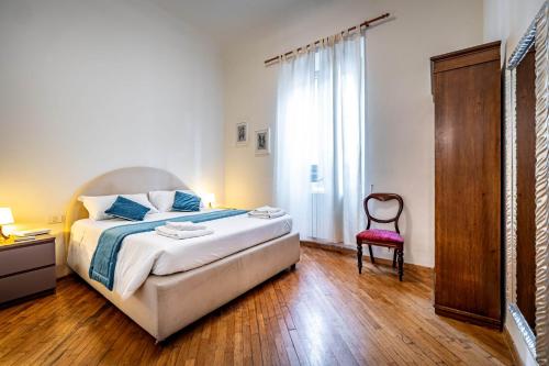 Appartamento Con Giardino tesisinde bir odada yatak veya yataklar