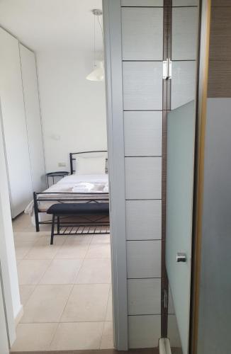 a door leading to a bedroom with a bed at Villa THAMI in Almirida