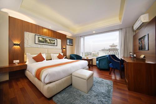 Postel nebo postele na pokoji v ubytování Kumari Boutique Hotel