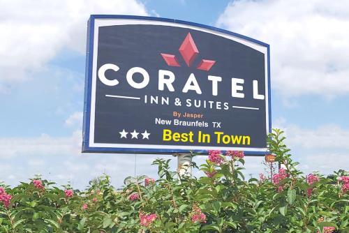 a sign for a cornell inn and suites at Coratel Inn & Suites by Jasper New Braunfels IH-35 EXT 189 in New Braunfels