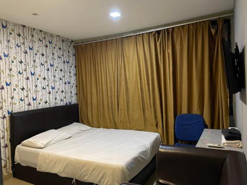 Postel nebo postele na pokoji v ubytování Hotel Global Subang