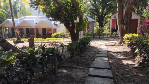 a walkway in front of a house at Blue Whale Resort and Restaurant in Neil Island