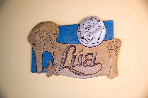 a sign on a wall with an animal on it at Hotel Rural Casona Trabadelo in Vegadeo