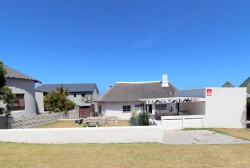 a view of the house from the backyard at flip flops in Agulhas