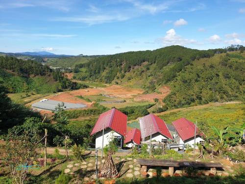 a group of houses with red roofs on a hill at Tuyên Chiến Home & Resort in Ấp An Kroët
